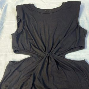 Side cutout maxi dress with padded shoulders and dual side splits.